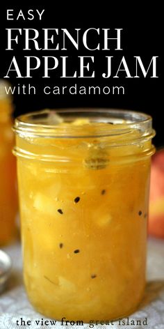 an easy french apple jam with cardamom in a glass jar on a table