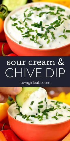 two bowls filled with sour cream and chive dip surrounded by peppers, cucumbers, and lemons