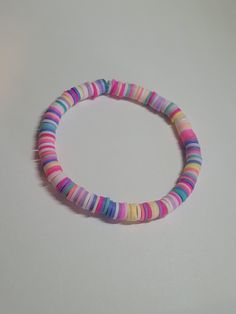 This bracelet is pink, white, blue, yellow, and purple. This bracelet would be a perfect gift for a bracelet lover. Pink Bracelet, Simple Jewelry, Colorful Bracelets, Clay Beads, Amazing Jewelry, Favorite Jewelry, Jewelry Bracelets, Perfect Gift, Beaded Bracelets