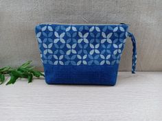 Boho Handmade Makeup Pouch Color: Blue and White Notes: The patterns on the pouch are not exactly the same due to the cut of the fabric. We will choose the pattern randomly for you, or if you want to select specifically, please send us a message !! Details: - The front and back of the pouch are made of cotton, dyed naturally into this indigo blue color. The tribal patterns are printed using block printing technique. - The size of the pouch makes it convenient for you to store makeups or small st Blue Rectangular Cosmetic Bag For Daily Use, Blue Portable Pouch Cosmetic Bag, Portable Blue Pouch Cosmetic Bag, Portable Blue Pencil Case Pouch, Blue Rectangular Pouch For Daily Use, Blue Cosmetic Pouch Bag For Personal Use, Rectangular Blue Pouch For Daily Use, Blue Pouch As Gift Bag, Blue Zipper Pouch For Daily Use