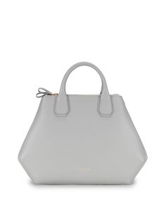 The geometrical shape of the New Vera bag ads an intricate touch to a classy look. Crafted in Italy the structured silhouette is made with semi-rigid grain leather to withstand time and everyday wear. The Vera top handle bag features 2 large zipper pockets and a soft elegant interior making it the perfect choice for everyday wear. Bag Ads, Bag Closet, Grey Shades, Work Tote Bag, Grey Bag, How To Make Handbags, Work Bags, Mini Crossbody, Perfect Bag