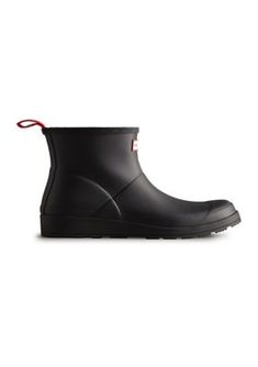 The PLAY Short Rain Boots from Hunter are a playful and practical choice for women. Crafted from the highest quality natural rubber, these boots are 100% waterproof and feature a 100% recycled polyester lining for added comfort. The pull tab allows for easy foot entry, while the flatter platform sole provides all-day comfort. With a design that grazes the top of the ankle, these boots are perfect for any occasion. | Hunter Women's PLAY Short Rain Boots, Black, 7M Black Boots With Rubber Sole For Rainy Weather, Black Boots With Recycled Rubber Sole, Black Waterproof Boots With Recycled Rubber, Black Waterproof Boots Made Of Recycled Rubber, Black Waterproof Ankle Rain Boots, Insulated Black Boots For Rainy Season, Insulated Black Ankle Rain Boots, Waterproof Recycled Rubber Rain Boots, Short Rain Boots