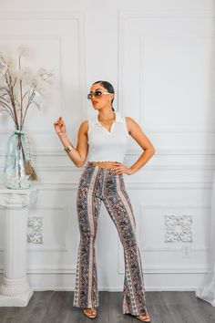 Make a stylish statement with our Paisley Infusion Bell Bottoms. With a playful paisley print, these pants are perfect for adding a touch of personality to any outfit. Buttery soft with great stretch, they're also comfortable and versatile. Perfect for standing out from the crowd in a fun and sexy way. Model is 5’4 wearing 3 1/2 in heals: size small Fit’s true to size Standing Out From The Crowd, One Shoulder Tops, Black Maxi Dress, Fashion Tops, Paisley Print, Bell Bottoms, Brunei, Casual Tops, Pant Jumpsuit