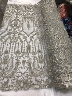 Silver Embroidered Lace For Wedding, Embroidered Silver Lace For Wedding, Silver Embroidered Wedding Lace, Elegant Silver Embellished Embroidered Fabric, Silver Lace With Intricate Embroidery For Wedding, Silver Wedding Lace With Intricate Embroidery, Fitted Silver Embroidered Fabric For Wedding, Silver Embroidered Fitted Fabric For Wedding, Silver Embellished Embroidered Fabric For Reception