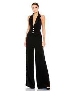 Sexy tuxedo-style jumpsuit with a plunging halter neckline and rhinestone brooch buttons. Ieena for Mac Duggal Fully Lined Front Closure 100% Polyester Plunging Halter Neckline Jumpsuit Style #2643 Jumpsuit Elegant Lulus, K Pop Suits, Wedding Guest Jumpsuit Lulus, Cocktail Attire For Women Nordstrom, Tuxedo Dress For Woman, Tuxedo Jumpsuit, Formal Jumpsuit, Satin Jumpsuit, Tuxedo Style