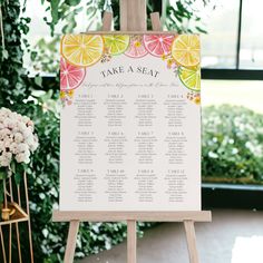 a table plan with lemons, oranges and watermelon slices on it