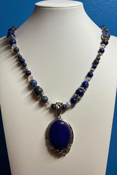 This is a gorgeous lapis lazuli pendant necklace that is sure to stand out!  I used an antiqued silver toggle clasp, antique silver bead caps and antiqued silver spacer beads . Be sure to check out the matching earrings and bracelet! This necklace is 26 inches long.  Since the earliest of times, lapis lazuli has been associated with royalty, strength and courage, wisdom and intellect, friendship and truth. Lapis lazuli has been associated with qualities like inner wisdom, inner peace and self-ex Blue Lapis Lazuli Jewelry With Silver Beads, Lapis Lazuli Pendant Necklace With Gemstone Beads, Silver Beaded Necklaces With Lapis Lazuli Natural Stones, Lapis Lazuli Jewelry With Silver Beads For Gifts, Silver Beaded Necklace With Lapis Lazuli Natural Stones, Silver Beaded Necklace With Natural Lapis Lazuli Stones, Silver Lapis Lazuli Jewelry With Polished Beads, Lapis Lazuli Beaded Pendant Jewelry, Lapis Lazuli Gemstone Beads Pendant Necklace