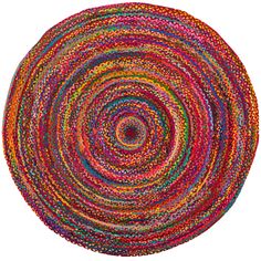 a round rug made out of multicolored yarn