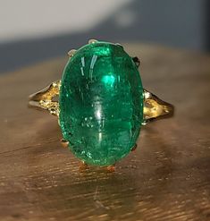 GORGEOUS vintage 14k yellow gold natural green emerald in cabochon oval shape circ 1940s  Center natural green emerald weight 6.13ct. size 13.8x9.5mm very nice rich green vivid color.nice luster very lively, nice cut. ring size 5.5  Resizable  Appraisal available  Retail value $12,500 net. Fine Jewelry Emerald Oval Cabochon Ring, Fine Jewelry Emerald Ring With Oval Cabochon, Emerald Oval Cabochon Ring As A Gift, Fine Jewelry Emerald Green Oval Cabochon Ring, Yellow Gold Emerald Ring Oval Cabochon, Yellow Gold Emerald Ring With Oval Cabochon, Green Oval Cabochon Emerald Ring, Heirloom Gold Emerald Ring With Oval Cabochon, Classic Cabochon Emerald Ring