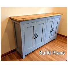 a blue cabinet sitting on top of a hard wood floor