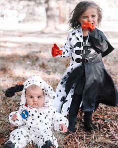 two young children dressed in dalmatian costumes