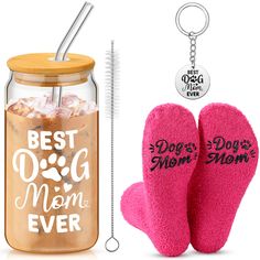 a pair of pink mittens next to a jar with dog mom ever written on it