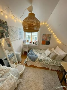 a bedroom with two beds and lights on the ceiling