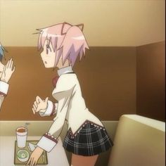 two anime characters sitting at a table in front of each other with their hands together