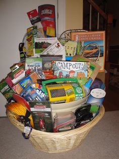 a basket filled with assorted items sitting on the floor