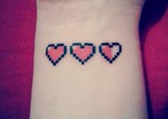 three hearts tattoo on the wrist