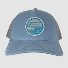 With a 3D woven label, this trucker design is sure to turn heads. - 2-Tone Stellar Blue / Grey - Snapback Trucker - 5 Panel - Curved bill - Cotton-Twill/Nylon Mesh Fabric - One size fits most Please allow 2-4 Business Days before your order ships, Thank you in advance for your patience. Casual Blue Baseball Cap With Logo Patch, Gray Casual Trucker Hat With Logo Patch, Adjustable Blue Trucker Hat With Embroidered Logo, Casual Outdoor Trucker Hat With Embroidered Patch, Blue Cotton Trucker Snapback Hat, Gray Trucker Hat With Logo Patch, Blue Six-panel Trucker Hat For Summer, Blue Baseball Cap Trucker Hat With Embroidered Logo, Blue Trucker Hat With Embroidered Logo And Flat Bill