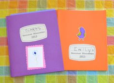 two children's personalized book covers on a plaid tablecloth with flowers and birds