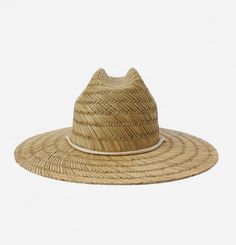 She likes wide open beaches— and wide brims to match. A staple for the sunny season, the New Comer hat is crafted in seagrass straw with a structured brim and a rope chin strap to combat beach breezes.