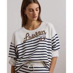 Reflecting the season’s nautical-inspired aesthetic this crewneck sweatshirt showcases horizontal stripes and a “Lauren Ralph Lauren 67”–embroidered logo at the chest. With a relaxed slightly cropped silhouette and dropped shoulders this layer is made with cotton French terry for a cozy feel. Sporty Striped Top With Ribbed Cuffs, Relaxed Fit Crew Neck Top With Signature Stripes, Nautical Cotton Sweater With Crew Neck, Nautical Cotton Crew Neck Sweater, Sporty Striped Crew Neck Sweatshirt, Fall Crew Neck Top With Signature Stripes, Casual Striped Sweatshirt With Ribbed Collar, Sporty Long Sleeve Tops With Signature Stripes, White Tops With Signature Stripes For Fall