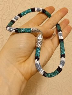 Turquoise  white seed bead necklace snake. Ouroboros.  Choker snake. Green white chain. Jewelry snake. Beaded bracelet snake. Hendmade exclusive gift. Christmas gift. Gift for her. Ouroboros jewelry. On the photo size necklace 17 inches. You  can find more jewelry in my Etsy shop: https://www.etsy.com/shop/MilaArtShopGifts?ref=seller-platform-mcnav Unique Turquoise Jewelry With Tiny Beads, Unique Handmade Snake Chain Jewelry, White Snake Chain Jewelry Gift, Handmade Snake Bracelet For Gift, Handmade Snake-shaped Bohemian Jewelry, Handmade Bohemian Snake Jewelry, Handmade Bohemian Snake-shaped Jewelry, Bohemian Adjustable Snake Jewelry, Handmade Snake Shape Necklace Gift