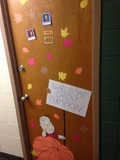 a door decorated with an image of a person holding a pumpkin and the words welcome to great pumpkin written on it