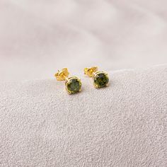 "With its shimmering pale green color, peridot stone is also known as the \"evening emerald\". It is a gemstone often associated with spirituality and expression. Peridot is the birthstone of August. Our 14K solid gold and round cut peridot earring is suitable for daily use with its special design and is a stylish jewelery that you can use on your special days and gift it to your loved ones. A stylish jewel for you and your loved ones. Time to pamper yourself and your loved ones... 🤍🤍 Special Green Prong Set Earrings As Gift, Green Earrings With Prong Setting As Gift, Green Prong Setting Earrings For Gift, Green 14k Gold Birthstone Earrings, 14k Gold Green Birthstone Earrings, Diamond Birthstone Ring, Rectangle Necklace, Queen Jewelry, Gold Diamond Earrings Studs