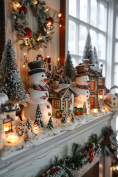 a mantel decorated with snowmen and christmas lights