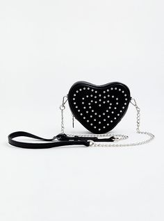 Your love for all things edgy will go noticed with this beautifully studded crossbody bag!     A bold, limited-edition collection that combines the pretty-meets-punk aesthetic of Betsey Johnson with Torrid’s. Top zip closure. 6”L x 1. 875”W x 5. 5”H. 58” removable crossbody strap. Interior zip pocket. Man-made materials. Imported. The best plus size women's betsey johnson black faux leather studded heart crossbody bag handbags in black. Torrid is your destination for the freshest sprin Edgy Party Crossbody Bag, Edgy Crossbody Party Bag, Edgy Crossbody Bag For Party, Edgy Party Bags With Rivets, Heart Crossbody Bag, Auli'i Cravalho, Hot Pink Leopard, White Lips, Punk Aesthetic