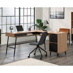 an office desk with two chairs and a bookcase