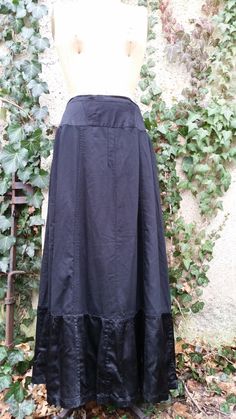 Black wool and satin Victorian skirt beautifully hand made with 1 front flap pocket.  Skirt closes with 1 side button.  Skirt is wool with 10" of satin fabric at hem.  Measures 30" at waist and 38" waist to hem.  Skirt is in good wearable condition.  Small hole see pic 4. Vintage Black Skirt With Buttons, Elegant Cotton Skirt With Button Closure, Side Button Skirt, Burberry Raincoat, Fancy Candles, Victorian Skirt, Black Maxi Skirt, Satin Maxi, Wool Skirt