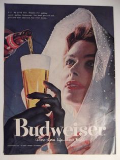 an advertisement for budweiser featuring a woman holding a glass of beer and pouring it into her hand