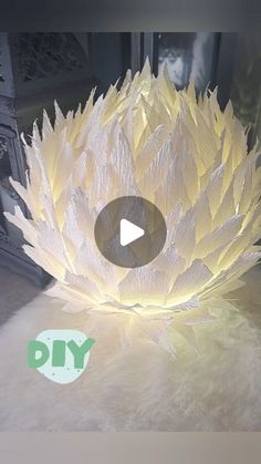 a large white flower sitting on top of a table