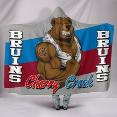 there is a bear that is holding up a sign with the words cherry creek on it