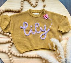 Hi! Welcome to my shop! I started making these sweaters a few months back and selling them on Facebook!  They come in a variety of sizes 0-3M up to 6T. Sweaters come in a variety of colors such as pink, blue, red, navy, gray, taupe, white, black, cream, & coffee! Sometimes sizes and colors are limited. Have a backup in mind. Please let me know the size, sweater color, and yarn color! If you don't see the yarn color you would like, mention it in the box and I will do my best to find it!  I can ad Cute Winter Sweater With Letter Embroidery, Cute Crew Neck Sweater For Birthday, Cute Crew Neck Birthday Sweater, Cute Crew Neck Sweater With Custom Embroidery, Cute Pink Sweater With Custom Embroidery, Cute Sweater With Letter Embroidery For Fall, Cute Cotton Sweater For Birthday, Cute Embroidered Knit Tops, Cute Letter Embroidery Sweater For Fall