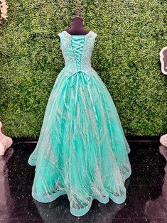 The Tiffany Princess 13575 Pageant Dress is the epitome of elegance. Featuring a high neck and crystal embellishments, this A-line gown exudes sophistication and grace. Made with sparkling glitter and quality materials, it will make any young girl feel like royalty. Perfect for pageants or any formal event. Sizes: 2-16 Colors: Aqua, Lilac, White Princess Style Floor-length Pageant Dress For Prom, Princess Style Floor-length Prom Pageant Dress, Elegant Pageant Dress With Fitted Bodice, Sparkling Dresses For Pageant During Prom Season, Princess Style Floor-length Pageant Dress For Debutante Ball, Embellished Floor-length Quinceanera Dress For Pageant, Elegant Gown For Pageant And Prom Season, Sparkling Sleeveless Gown With Fitted Bodice, Elegant Floor-length Glitter Tulle Gown