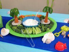 there is a platter with carrots, celery and other vegetables on it