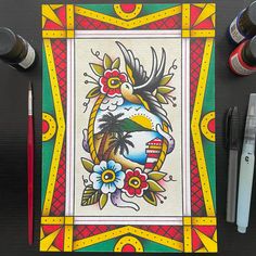 a painting on a table with markers and pens