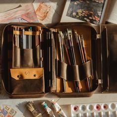 Artist brush bag is made of genuine leather and will hold all that you need. It's a perfect case to keep pens, pencils, and brushes in one place. We offer it in 8 colors. The multifunctional bag includes removable parts, allowing you to customize the internal organization according to your individual needs.  Also, you can add personalization. ♦ ♦ ♦ ♦ ♦ ♦ ♦ ♦ ♦ ♦ ♦ ♦ ♦ ♦ ♦ ♦ ♦ ♦ All our products are made to order with great care and special attention in our workshop. It's a unique handcrafted ite Leather Cases With Pen Slots For Daily Use, Everyday Pencil Case With Pen Slots, Leather Pencil Case With Pen Slots For Travel, Artistic Pencil Case With Pen Slots, Artist Bag, Brush Organizer, Back To School Organization, Oil Brush, Artist Brush