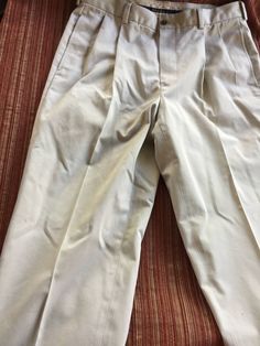 Preppy khaki pants, high waisted and pleated. The label says Brooks Brothers Advantage Chino Elliot, 100 percent Cotton and they're in perfect shape. Very loose fit and comfy. Men's size 34/30, which translates to a size 13 women's pants. Also, please take a look at my storefront at: https://www.etsy.com/shop/FabFinds42?ref=seller-platform-mcnav I have a wide selection of one-of-a-kind items, from clothing and toys to home decor and gift items, and I add new things almost every day. Classic Khaki Bottoms, Classic Khaki Full Length Bottoms, Classic Khaki Pants, Classic Full Length Khaki Bottoms, Classic Full-length Khaki Pants, Classic Full Length Khaki Pants, Beige High-waist Pleated Bottoms, High Waist Pleated Beige Bottoms, Beige Pleated High-waist Bottoms