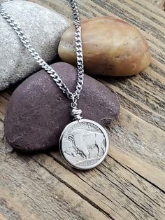 Classic Buffalo Nickel Coin Necklace - Versatile Necklace for Man or WomanGenuine buffalo nickel coin mounted in a vintage brass or silver coin bezel. Hung from a stainless steel fine curb chain. Minimalist styling for today's trendy multi-chain pairings.Choose from 24 - 34" length from dropdown. Closure: Stainless lobster claspUnisex styling for man or woman.Excellent gift idea at a great price. (origphoto6478) Cheap Nickel-free Coin Necklace With Round Pendant, Cheap Nickel-free Silver Coin Necklace, Nickel-free Sterling Silver Coin Necklace As Gift, Jewelry Layering Necklace, Single Necklace, Sterling Silver Amulet Coin Necklace, Tarnish Resistant, Jewelry Layering, Necklace Minimalist Jewelry, Antique Silver Nickel-free Coin Necklace