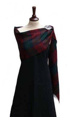 - Made in Scotland - Medium Weight (13oz) Wool - Premium Wool Tartan - Measures Approx. 27″ x 72″ These stoles are made in Scotland from medium weight (13oz) premium wool tartan. They are a great way to represent your heritage in any setting. The stole is also a perfect way to add a bit of warmth or elegance to any ladies attire. It's a lovely accent piece to display your tartan with any casual or formal wear. 27″ wide by 72″ long. Black Dress With Tartan Sash, Dress Stuart Tartan, Flannel Wedding Dress Plaid, Tartan Bridesmaid Shawl, Tartan Wedding Dress Scotland, Tartan Bridal Shawl, Scottish Wedding Dress Sash, Mackenzie Tartan, Tartan Sash