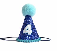 a blue party hat with the number four on it