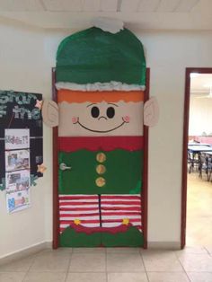 a door decorated to look like a nutcracker with green hair and red pants