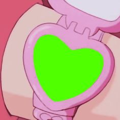 a pink toilet with a green heart on the lid