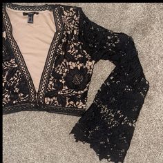 Nwt, Bell Sleeves, Whole Top Is Lace, Bodice Has Nude Lining And Sleeves Do Not. Flower Lace Detail. Four Clasps That Come Together Under The Plunging Neckline. Not Stretchy. Cropped. Chic V-neck Lace Crop Top, Chic Lace V-neck Crop Top, Spring Lace Crop Top For Night Out, Chic Open Front Top For Night Out, Elegant Forever 21 Tops For Going Out, Summer Open Front Tops For Night Out, Forever 21 V-neck Party Crop Top, Chic V-neck Crop Top Forever 21, Elegant Forever 21 Crop Top For Spring