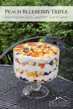 a trifle is sitting on top of a table with the words peach blueberry trifle below it