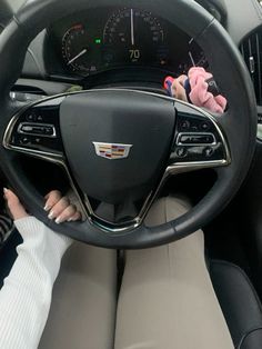 the interior of a car with steering wheel and dashboard