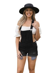 Your casual everyday overalls with a 5 pocket design. Comfortable and stretchy for all day wear. Distressed with whiskers and handsanding. Denim shorts with rolled cuffs. Junior size. Model is 5'7" wearing a size Medium.

 Fabric: 69% Cotton, 22% Polyester, 7% Rayon, 1% Spandex | Stretchy 
 Single Chest Pocket | 5 Pocket Design | 2 Button Side Closure | Mid Rise 
 Distressing with Whiskers and Handsanding | Overall Shorts
 Junior Sizing: 26" Inseam | Machine Wash Cold 
 Rolled Cuffs | Racerback Trendy Black Shortalls For Summer, Black Cotton Shortalls For Summer, Trendy Shortalls With Suspenders, Trendy Shortalls With Suspenders For Spring, Trendy Spring Shortalls With Suspenders, Black Denim Overalls For Summer, Summer Black Denim Overalls, Trendy Black Denim Overalls, Black Denim Overall Jumpsuit For Summer