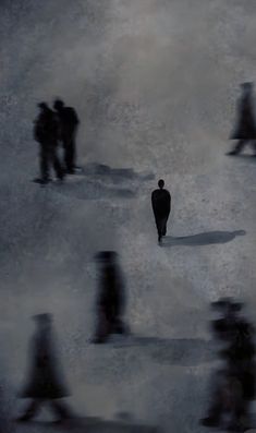 a group of people walking across a snow covered field in the middle of winter time